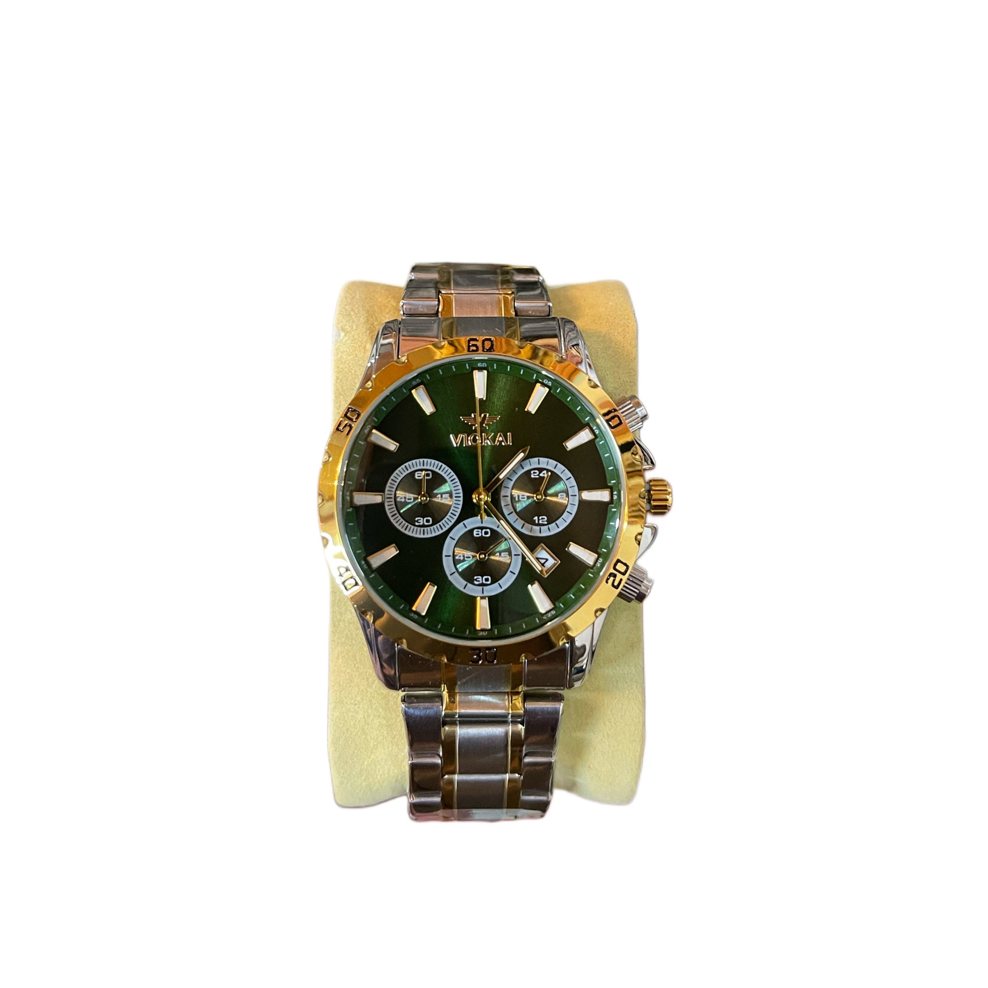 Gold and green watch on a white background